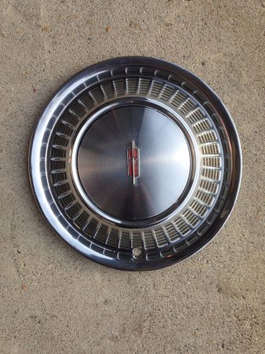 Good 1971 oldsmobile toronado hubcap. nice condition #1