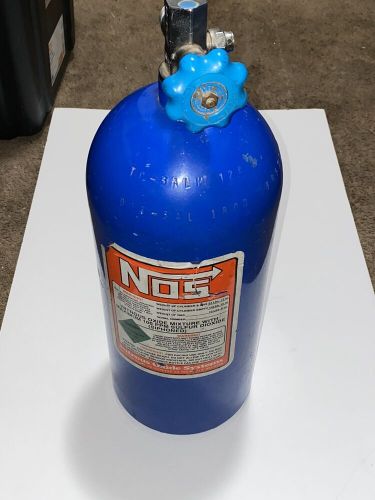 Empty nos nitrous tank holds 10 lbs of gas and weighs 24lbs. 12 oz. filled