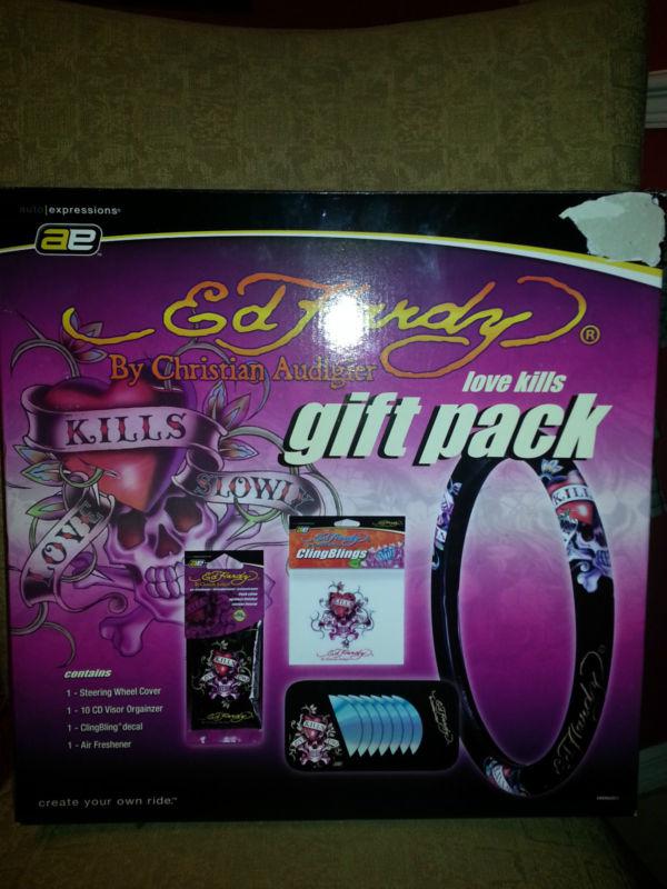 Ed hardy auto expressions gift set....steering wheel cover, cd organizor..& more