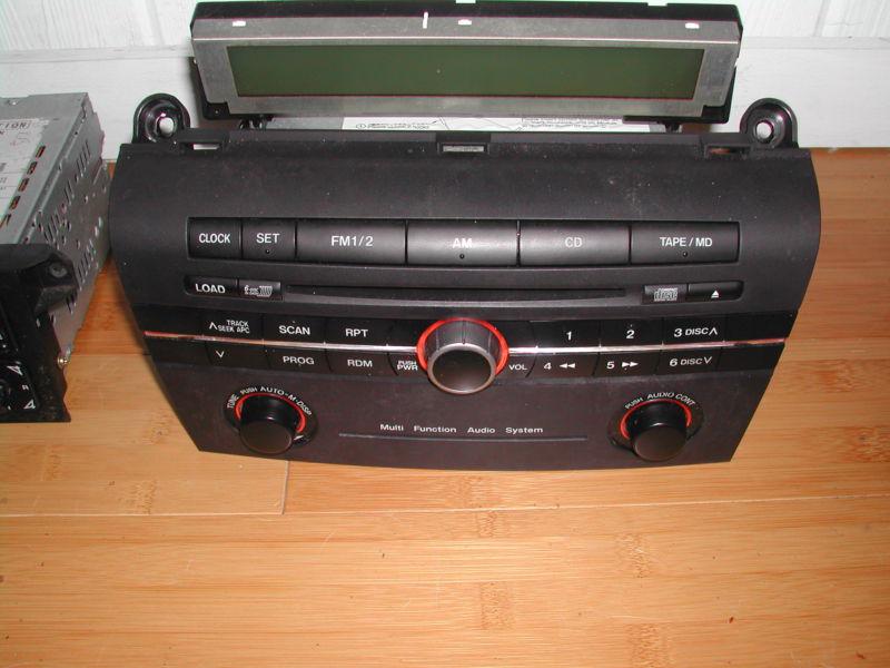 2004 mazda 3 tuner/recvr, trim panel, am-fm-cd, sgl cd player 