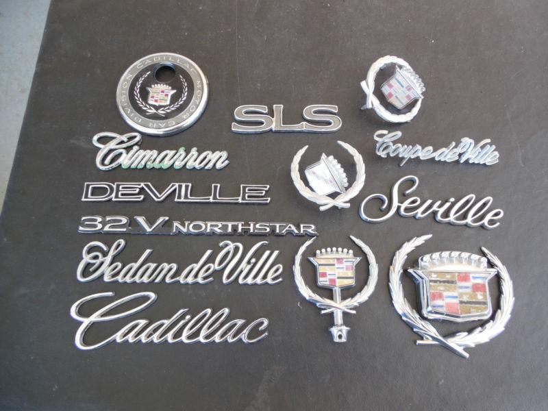  cadillac emblems & hood ornaments - 16 pieces