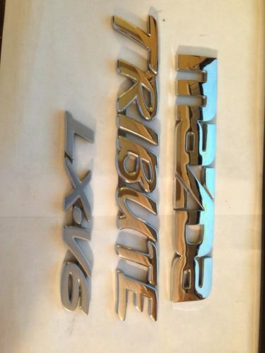 Mazda tribute rear gate emblem set used