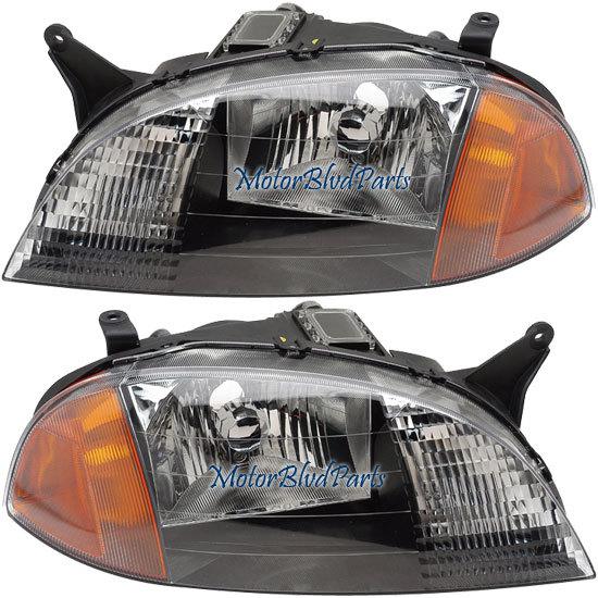 98-01 chevy metro headlights headlamps left + right set