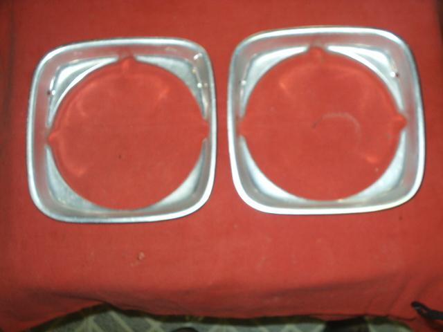 73 olds omega head light trims  