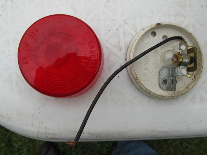 Brand new red trailer marker light assembly.