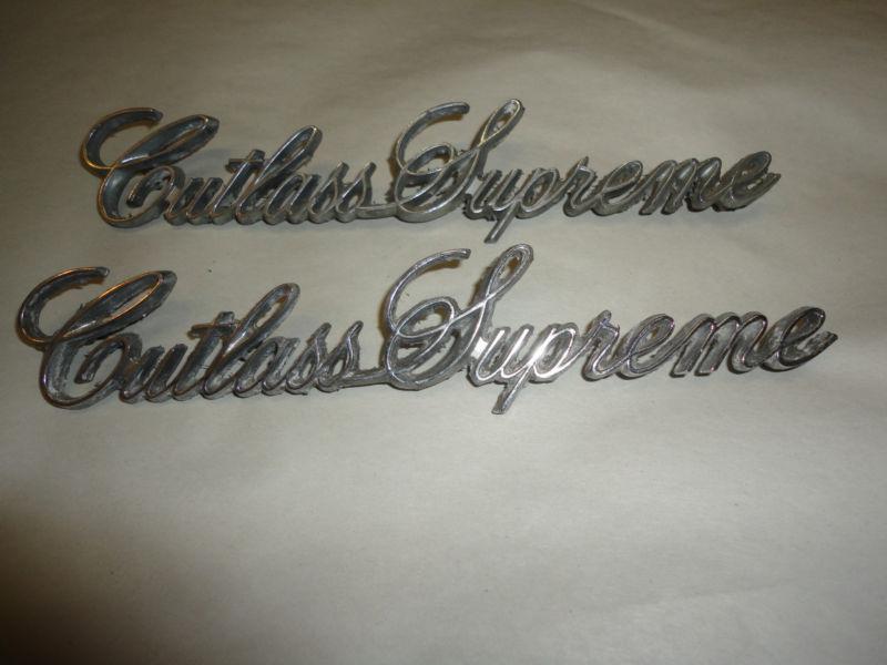 Pair of oldsmobile cutlass supreme emblems