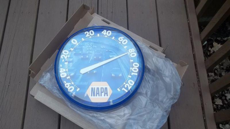 A napa original--- new in the box round wall ==neat auto decorative item