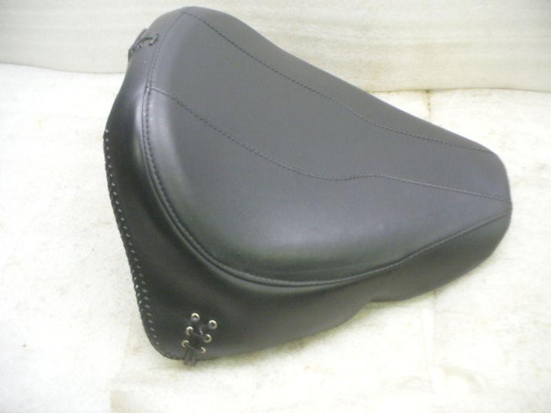Harley 07-up flstf fatboy oem solo seat with side skirts & braided edges.