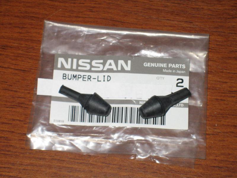 Datsun 620 pickup gas door bumpers - nos