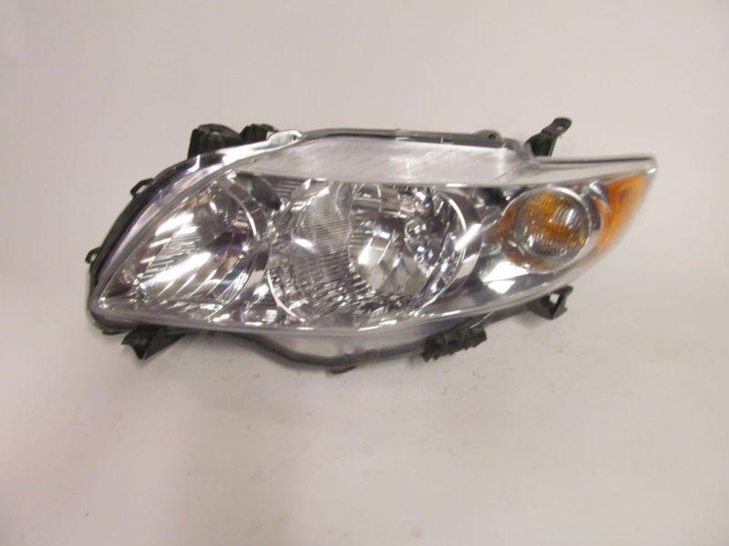 09 2010 toyota corolla left headlight nice!