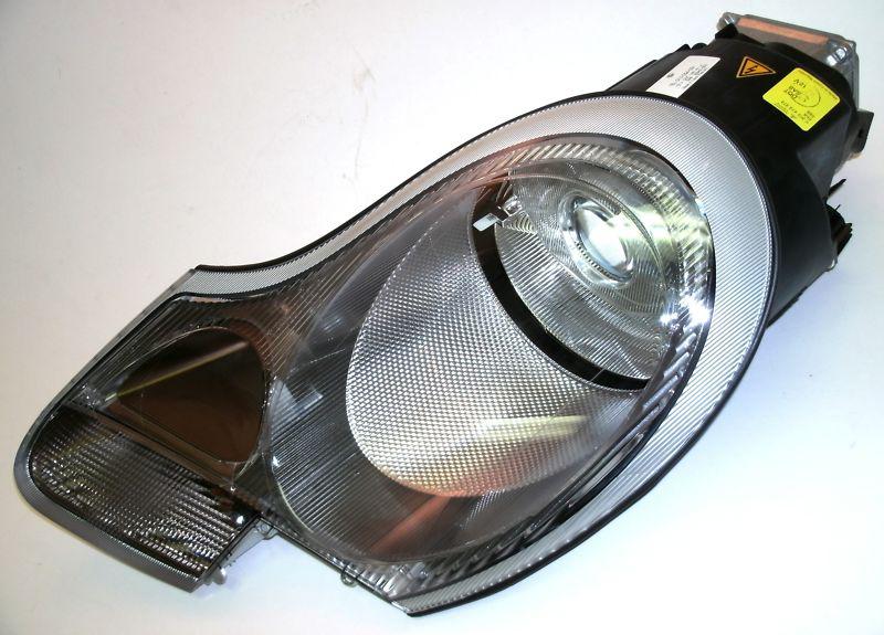 New porsche xenon headlamp (left) 911 boxster (1999-2004) oem hella 99663115707