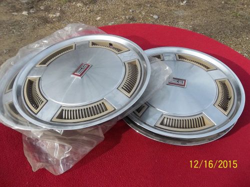 4 vintage 14 inch oldsmobile hub  caps