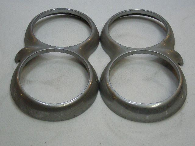 Used original pair of 1958-1962 corvette headlight bezels