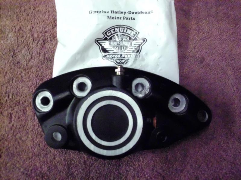 Harley new in bag rear or front brake caliper assembly. front half with piston