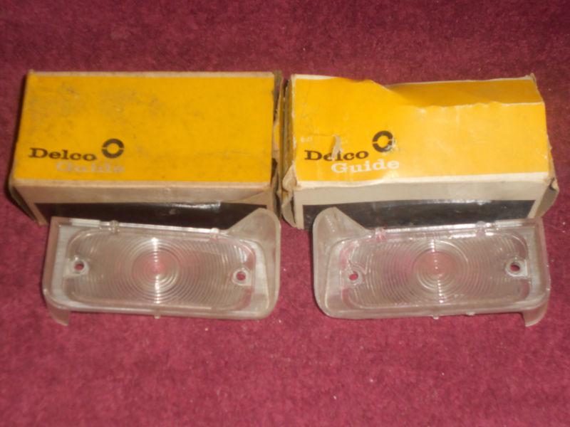 Nos 1963 / 1964 pontiac  parking light lenses lh & rh / manual installation