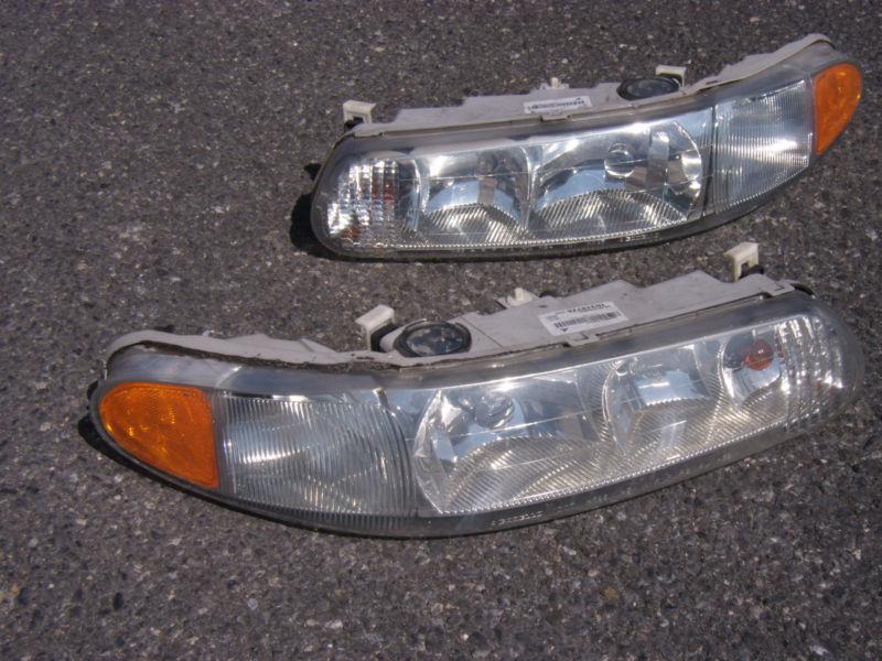 Head light lenses- left & right buick 1999 century