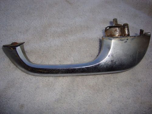 Used. 1960 ford country sedan 4 dr. left front exterior door handle