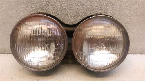 1962 cutlass pair of drivers left headlights w/bracket