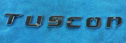 Hyundai tuscon body side or tailgate emblem.