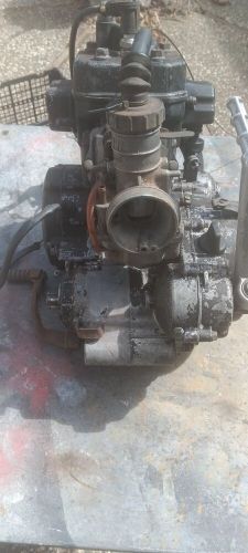 Kx125 complete engine motor includes carb and electrical components. 1983