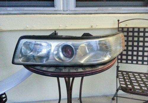 98 99 00 01 02 03 04 cadillac seville sls sts driver / left headlight lamp