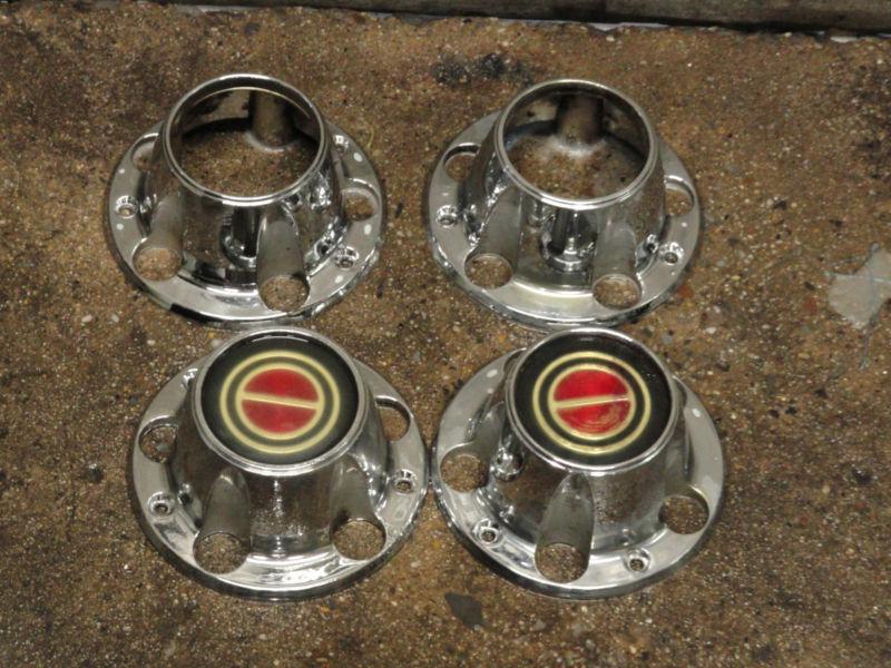 1980 to 1996 ford f150 / bronco 4x4 red emblem used wheel  center caps set 