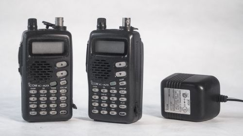 Two icom ic-a23 vhf airband transceivers - aviation handheld radios -