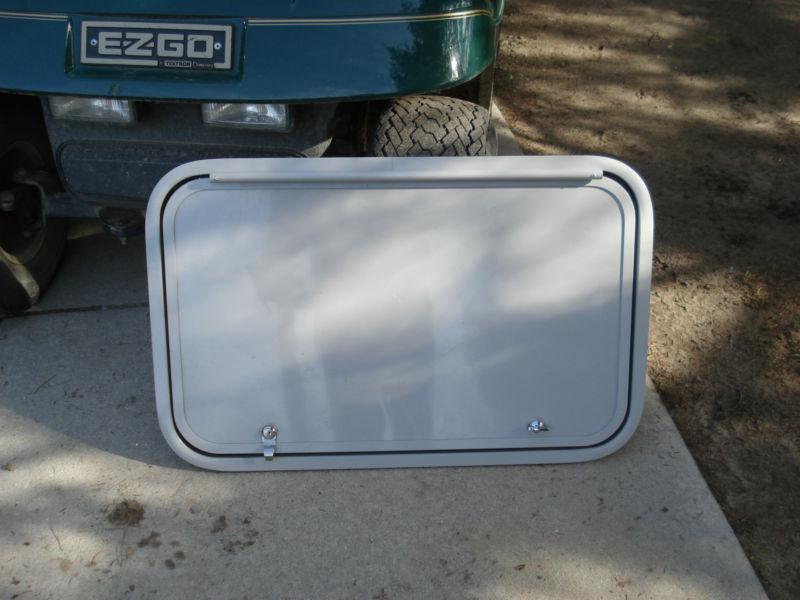 Trailer baggage door, clay color, 29" x 18", keys / locks / frame, etc. new