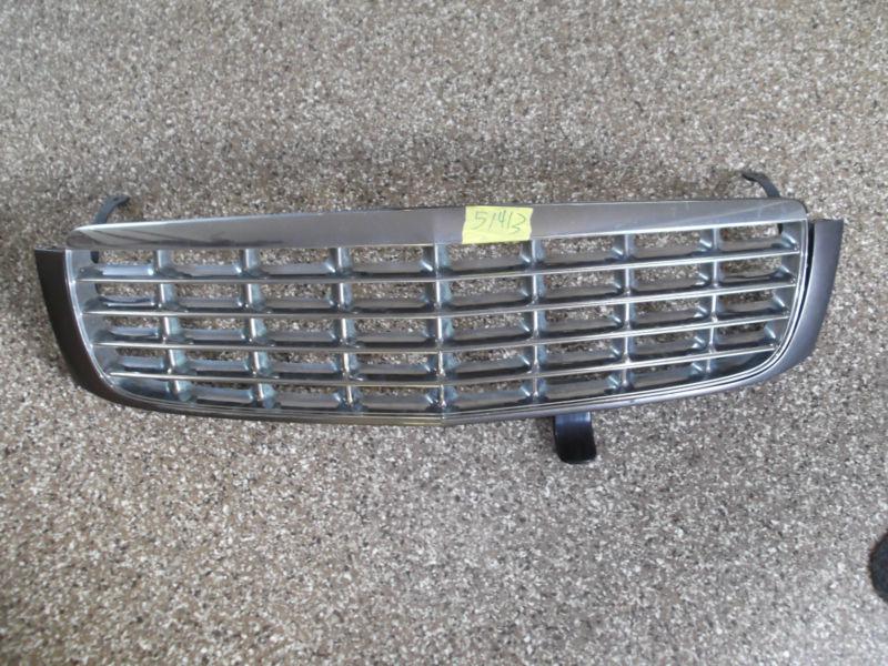 97 98 99 cadillac deville - chrome grille w/ silver trim bezel