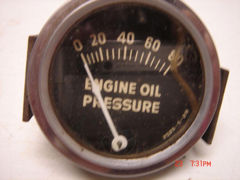 Old oil pressure gauge 2" diameter with mounting bracket