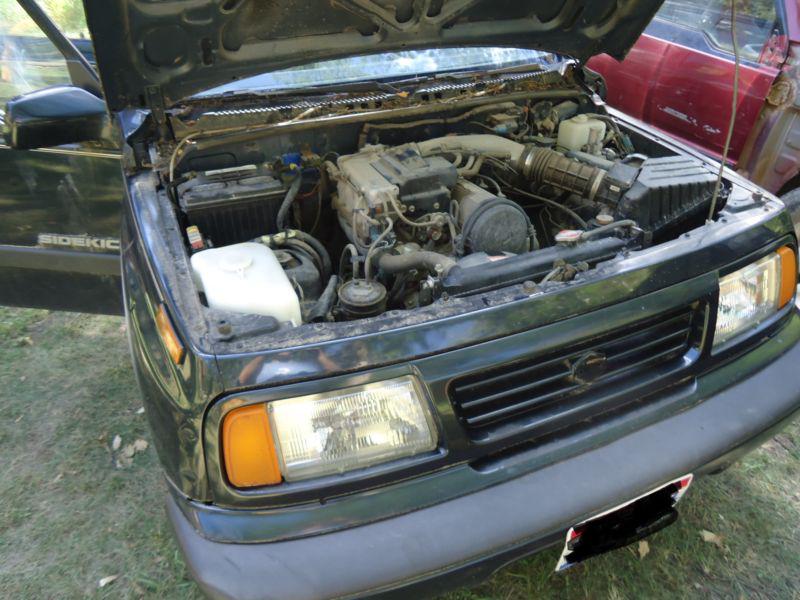 89-98 suzuki sidekick, geo tracker headlight, great used. left, driver side