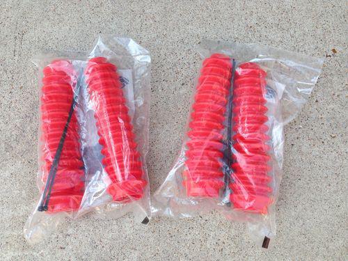 Four (4) red pro comp shock boots part no. 12128