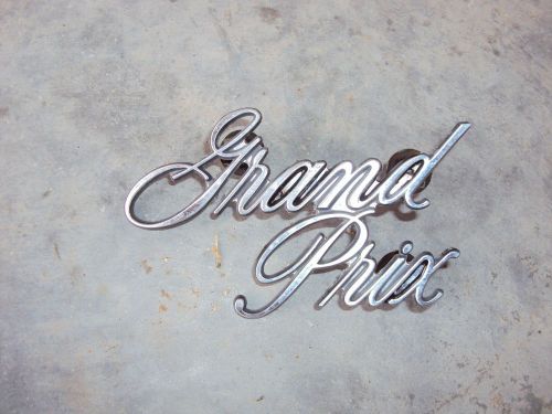 71 72 grand prix front header panel script emblem  481796
