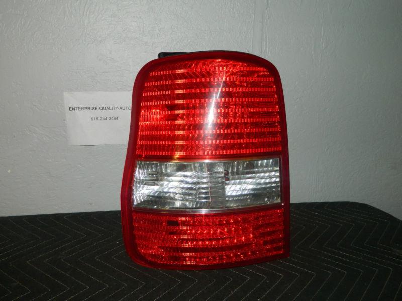 Oem 2003-2004 kia sedona left / driver side tail light assembly