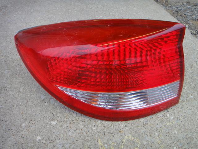 04 rio lh tail lamp 03-05 sedan nice used