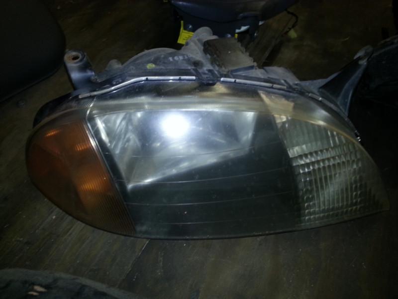 Geo metro passenger side headlight used  1998-up style