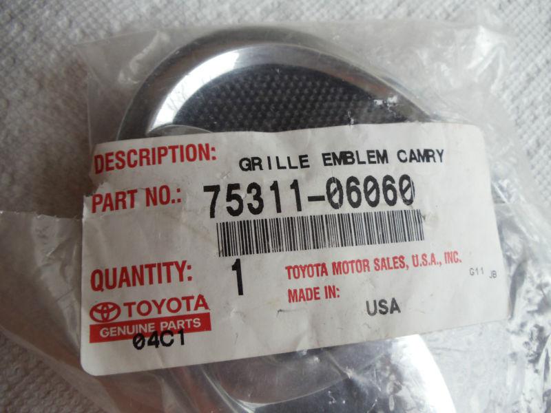 2007-2010 toyota 7531106060 radiator grille, or front panel emblem..new...sealed