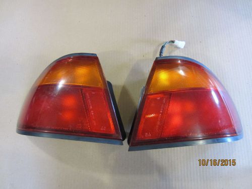 2 tail light assembly right and left mazda protege 1995-1996