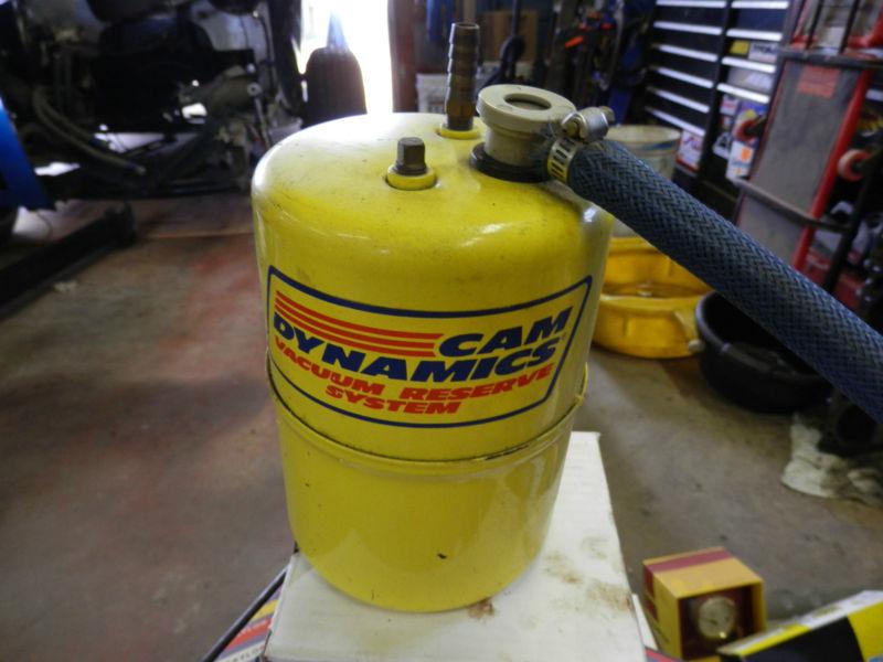 Cam dynamics vacuum canister