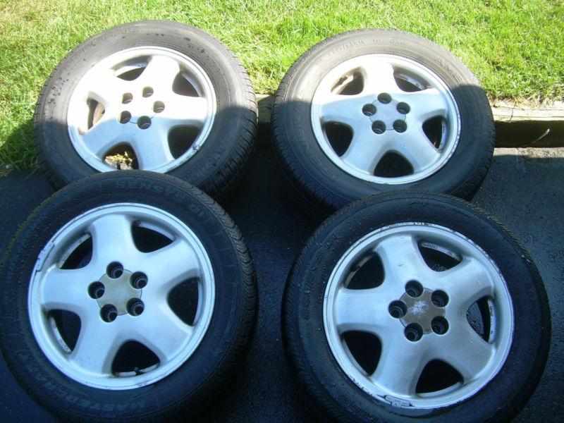 Four aluminum wheel rims off a 1993 toyota celica gt, 15 x 6jj-45, w/20 lugs