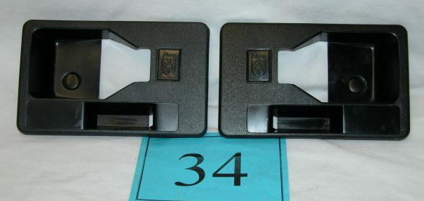 84-88 fiero black inner door handle trim panels for cars w/o power locks  pair