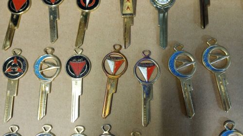 Lot of 41 vintage gold tone &amp; enamel car / auto key blanks dodge / plymouth