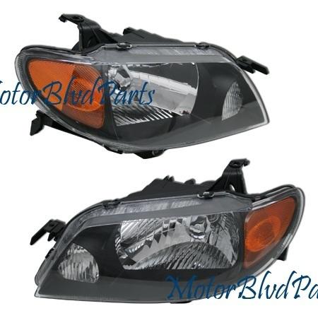 01-03 protege crystal black headlights headlamps pair