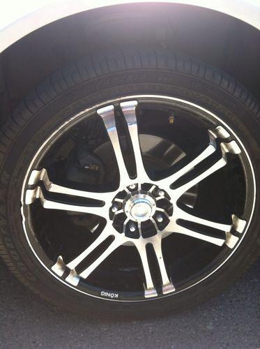 4 konig rims w/low profile tires. 18" inch. black and silver. on nissan altima.