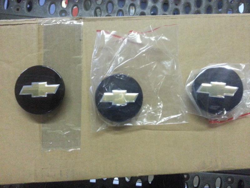 9593169 - brand new- 3 chevy center caps - black w/gold bowtie - 