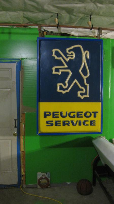 Peugeot dealership sign giant