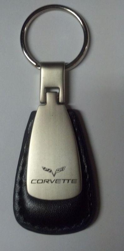 Corvette with flags silver color metal encased in leather  keychain