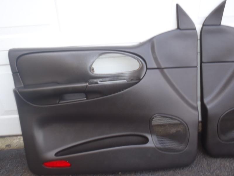 07 chevrolet trailblazer ss driver side front  door panel black