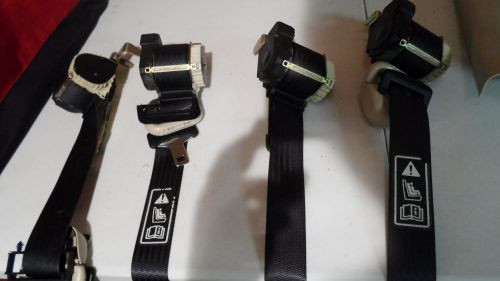 03-06 oem front left and right seat belt retractors with trim  read description