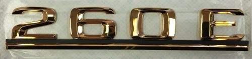 Nos new genuine mercedes benz 260e gold emblem